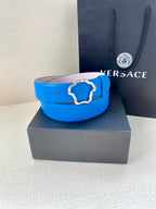 Versace belt in bright blue leather with decorative metal buckle on a box