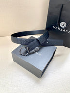 Versace belt on box, dark navy logo pattern with ornate silver-toned buckle.