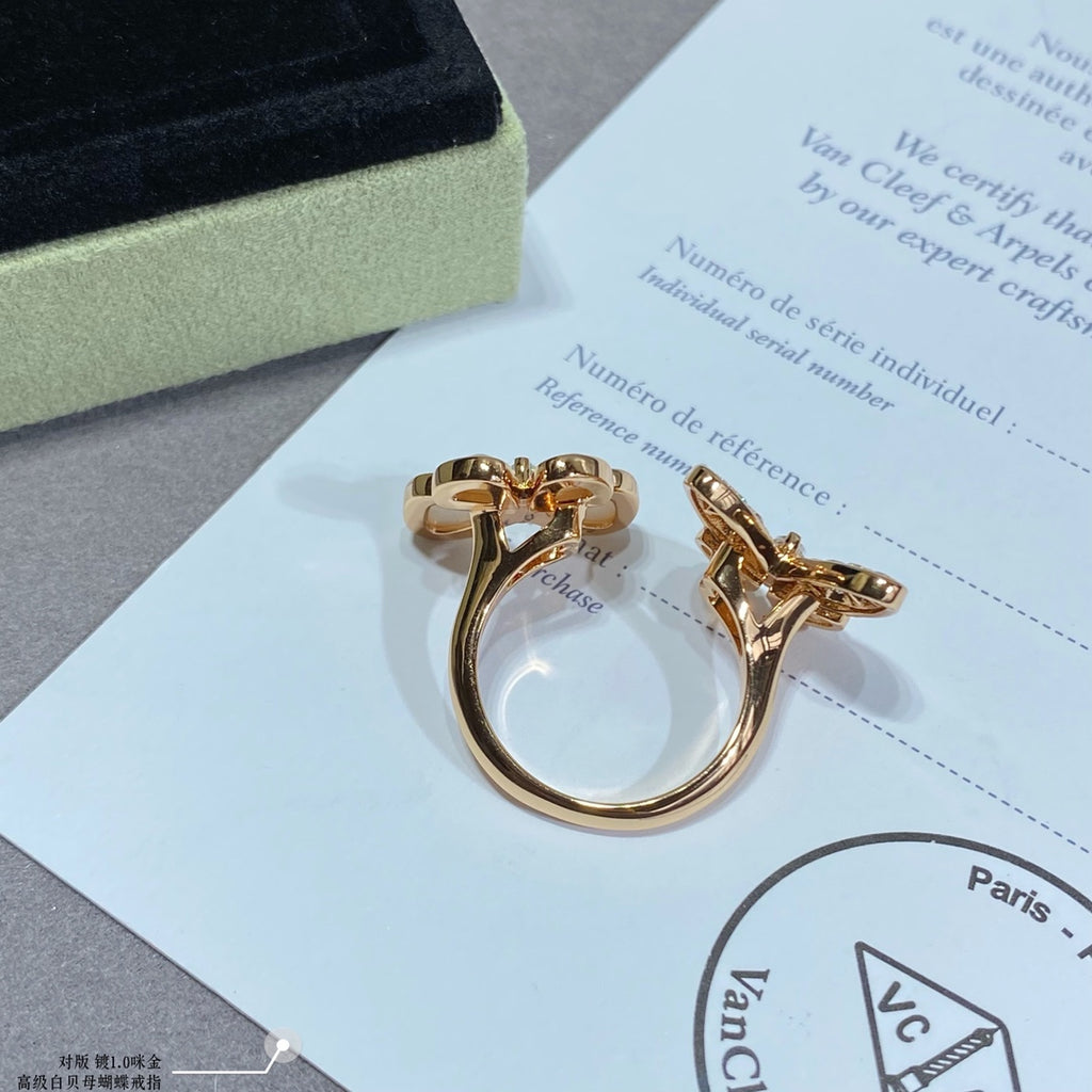 Gold butterfly rings with white opal and pavé stones on card