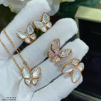 Butterfly earrings set with white opal and clear pavé stones