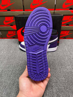 High-top sneaker outsole in purple with textured tread and circular traction detail