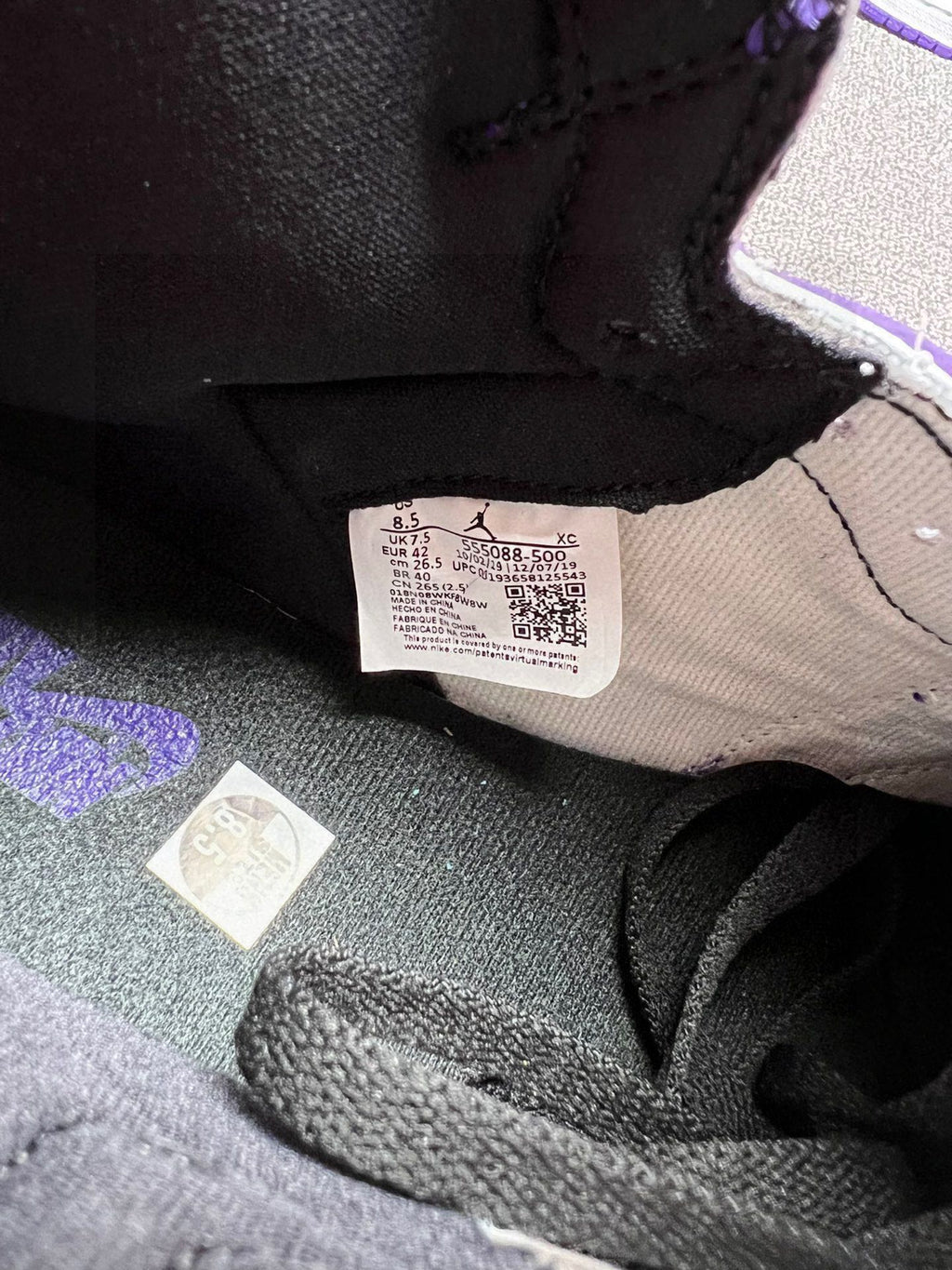 Shoe interior label and black lining inside a high-top sneaker