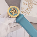 Sky blue leather belt with gold Medusa style round buckle on top strap