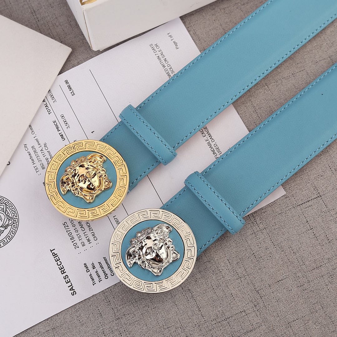 Sky blue leather belt with two round Medusa style buckles, gold and silver