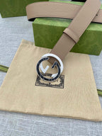 Gucci leather belt in light tan with round gold-tone logo buckle