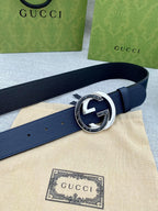 Navy leather belt with round silver and blue GG logo buckle