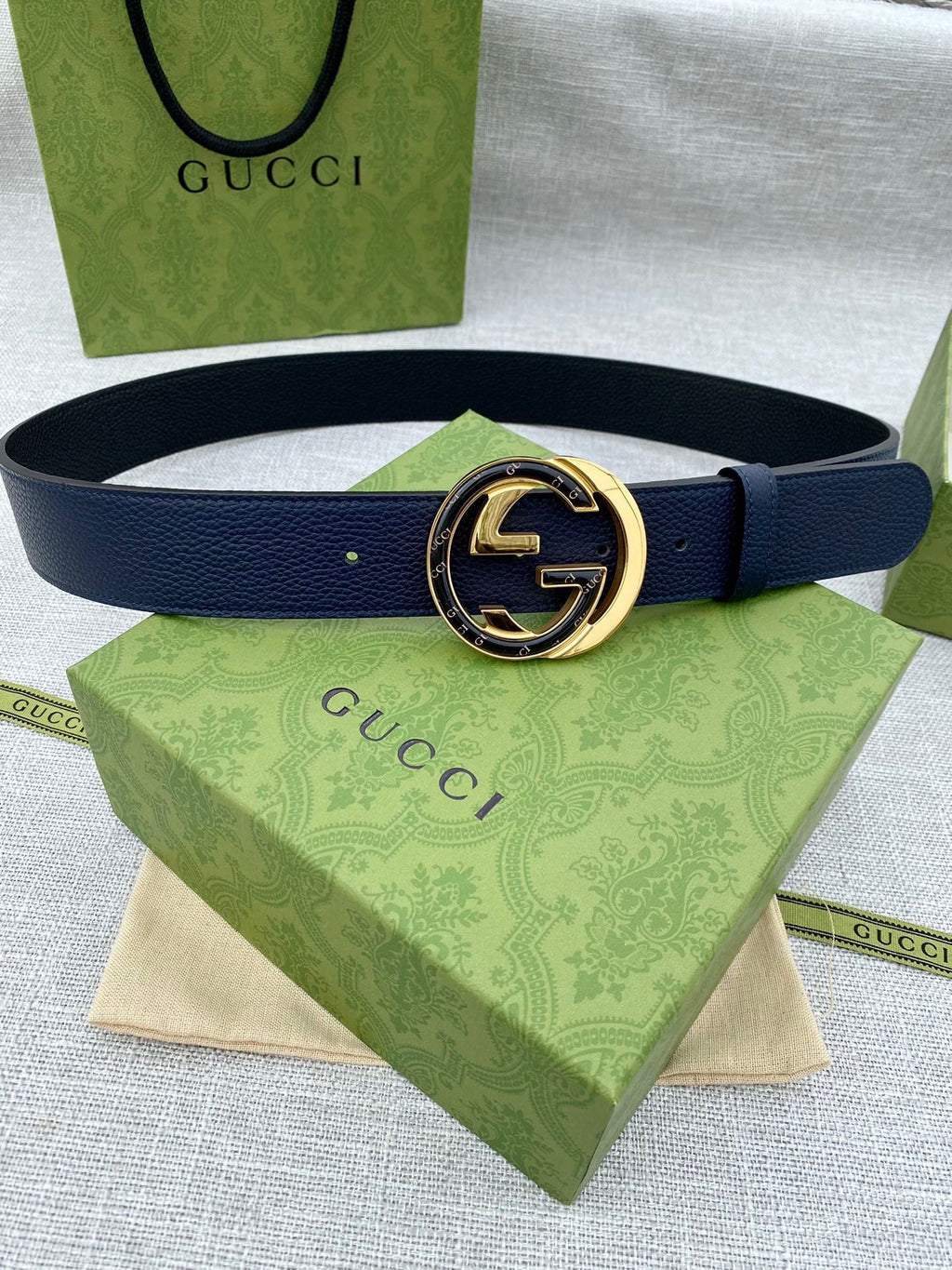 Navy leather belt with round gold-tone GG logo buckle