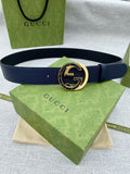 Navy leather belt with round gold-tone GG logo buckle