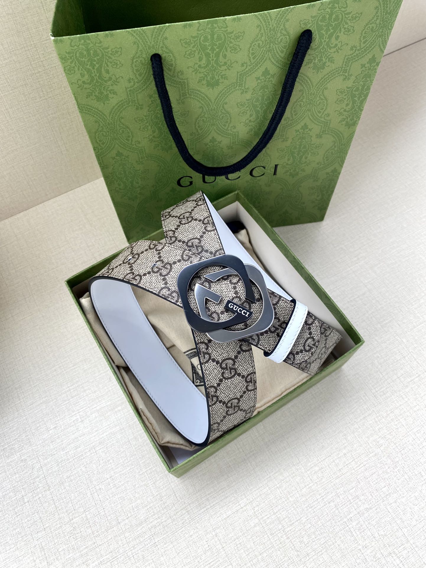 Gucci belt in box, beige-brown GG canvas strap with white leather edge and round interlocking G buckle