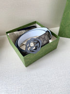 Gucci belt, GG monogram strap with round gold buckle and white leather reverse
