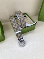 Gucci belt, GG monogram strap with white leather edges and dark metal interlocking buckle