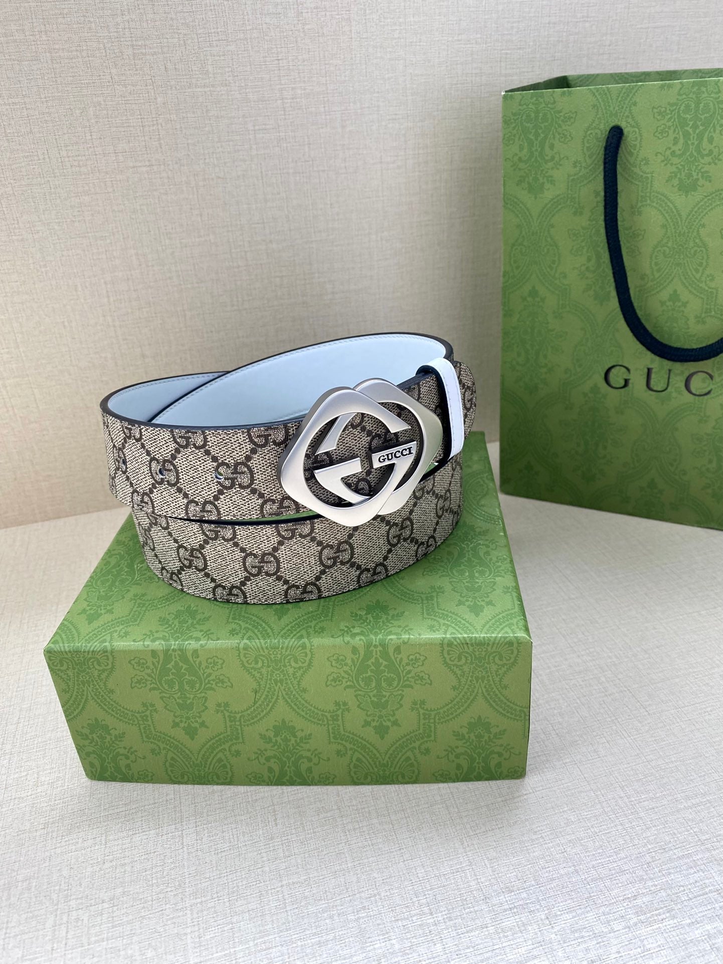 Gucci belt with GG monogram canvas and silver-tone Interlocking G buckle, white leather lining