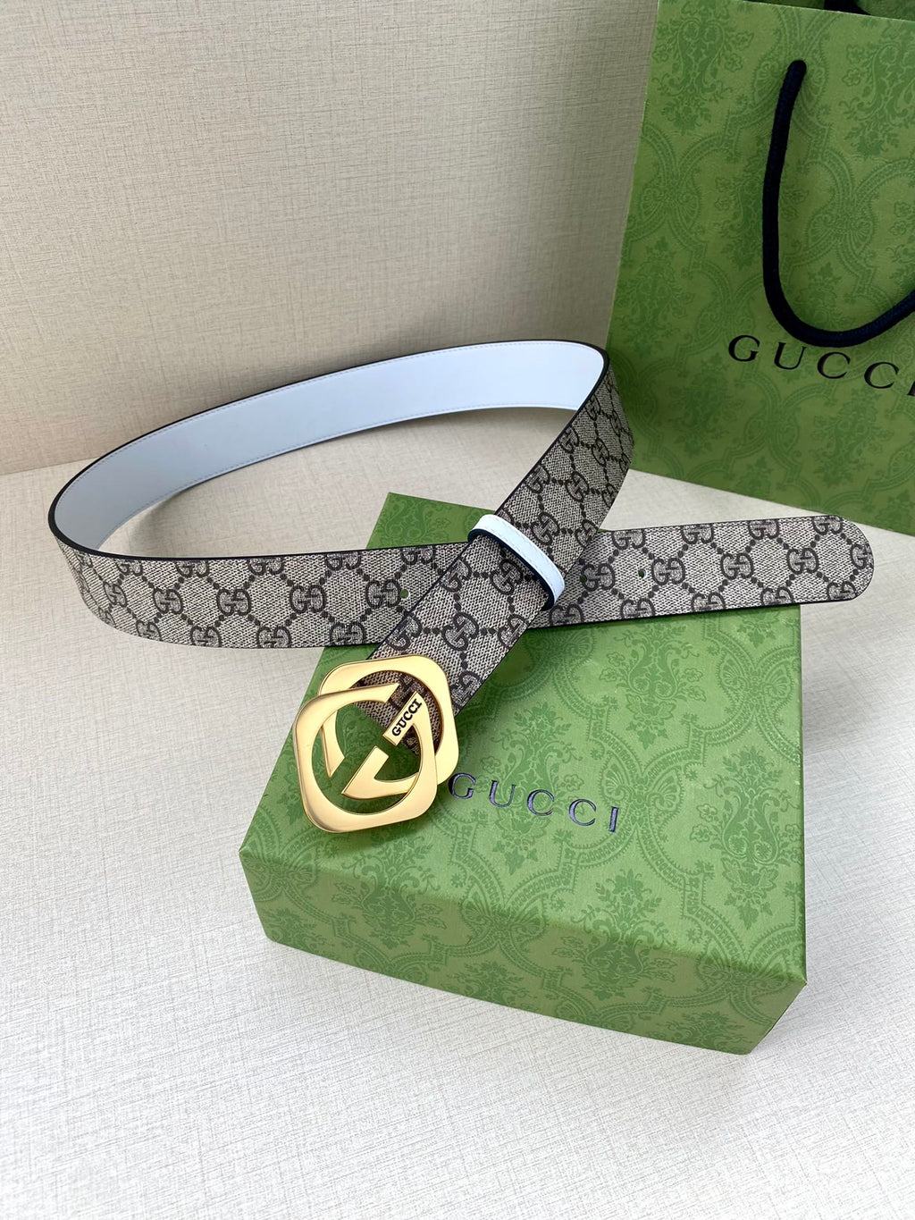 Gucci belt with GG monogram canvas strap and gold-tone Interlocking G buckle, white edging