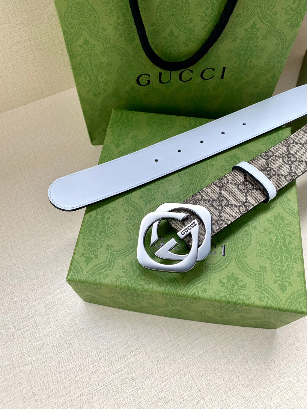 Gucci belt with white leather strap and GG monogram canvas, silver-tone Interlocking G buckle