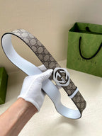 Gucci belt held up: GG monogram canvas strap with silver-tone Interlocking G buckle