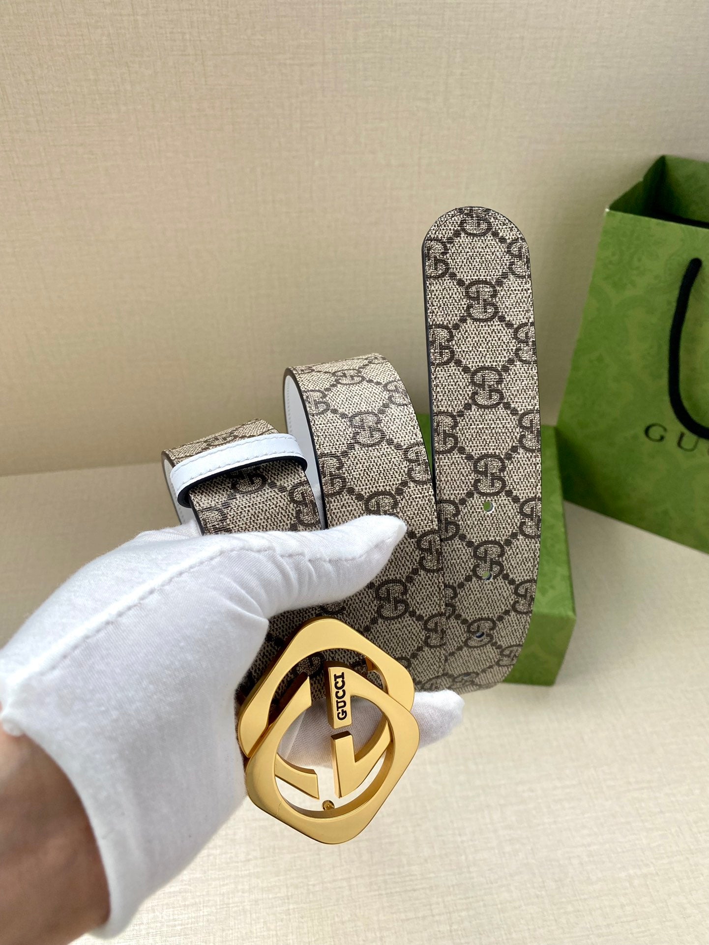 Gucci belt with GG monogram canvas, gold-tone Interlocking G buckle, white leather trim