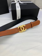 Tan leather belt with gold-tone CC buckle, shown at an angle with box and ribbon