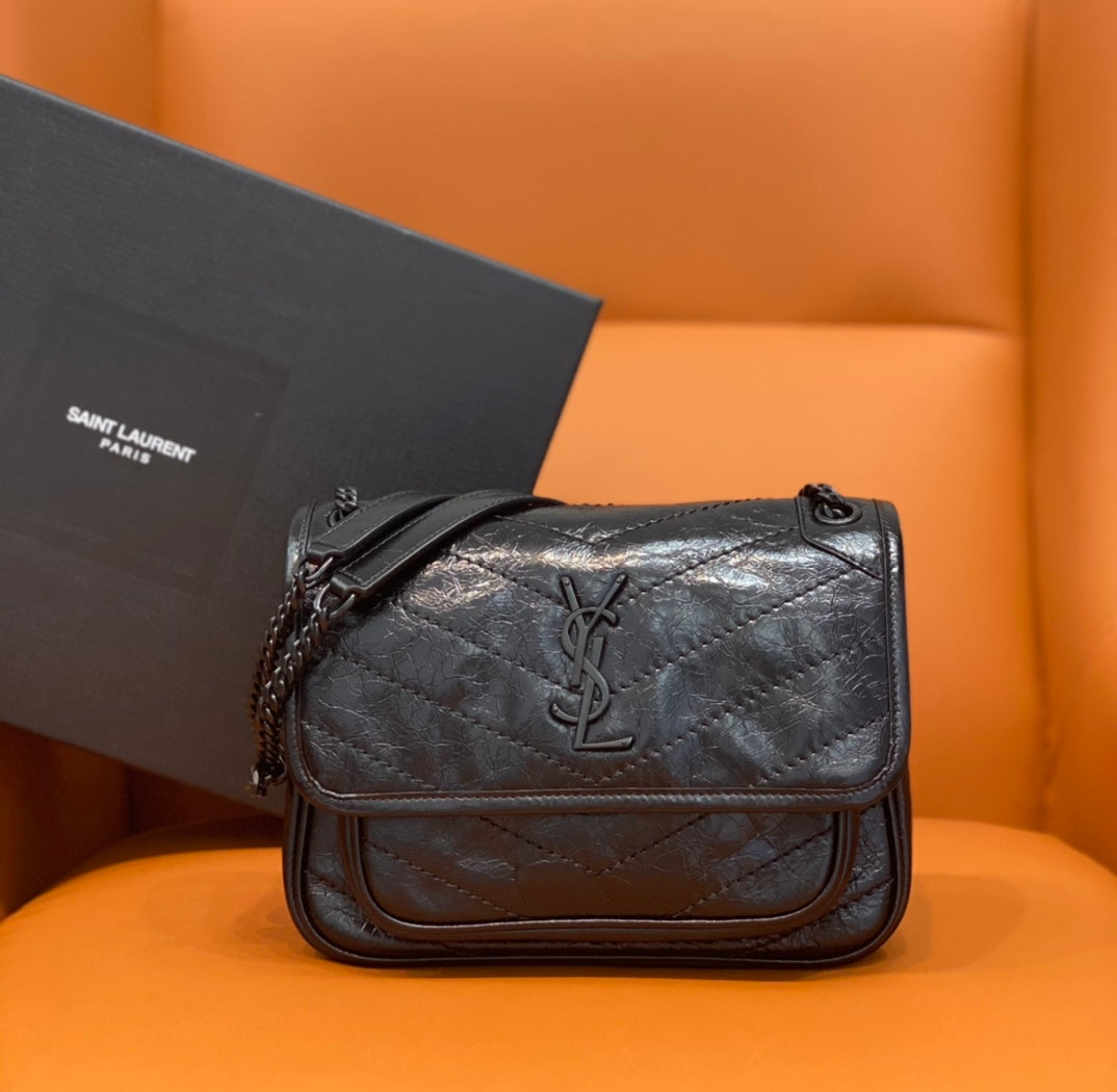 Saint Laurent quilted leather crossbody bag with flap and chain strap