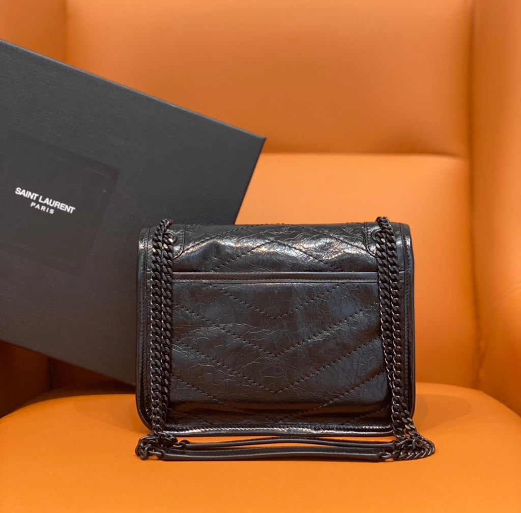 Saint Laurent quilted leather crossbody bag with front flap and chain straps