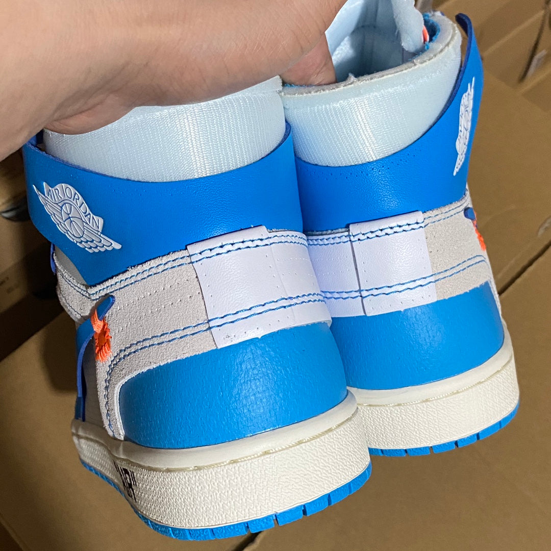 Blue and white high-top sneaker heels with winged emblem on the ankle tabs.