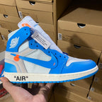 Blue and white high-top sneakers with orange accent, lace-up closure.