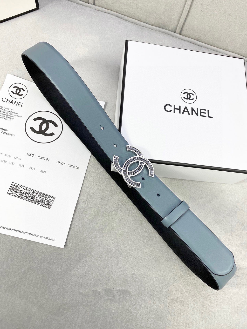 Chanel belt with CC buckle, muted blue strap and black edge leather