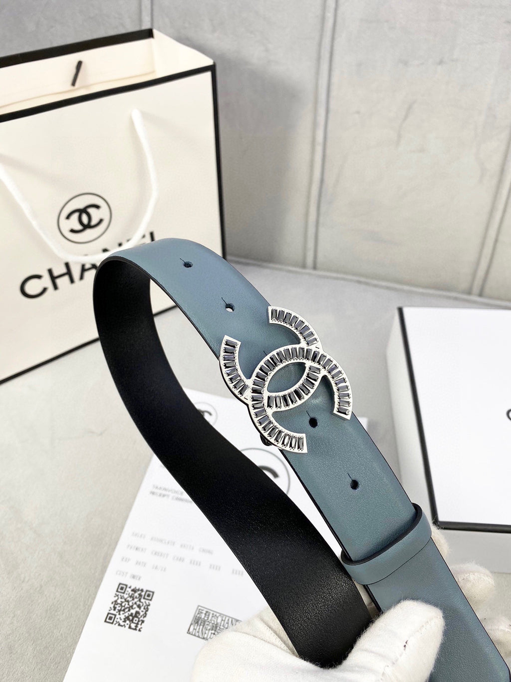 Chanel leather belt in muted blue with CC buckle and black reverse side