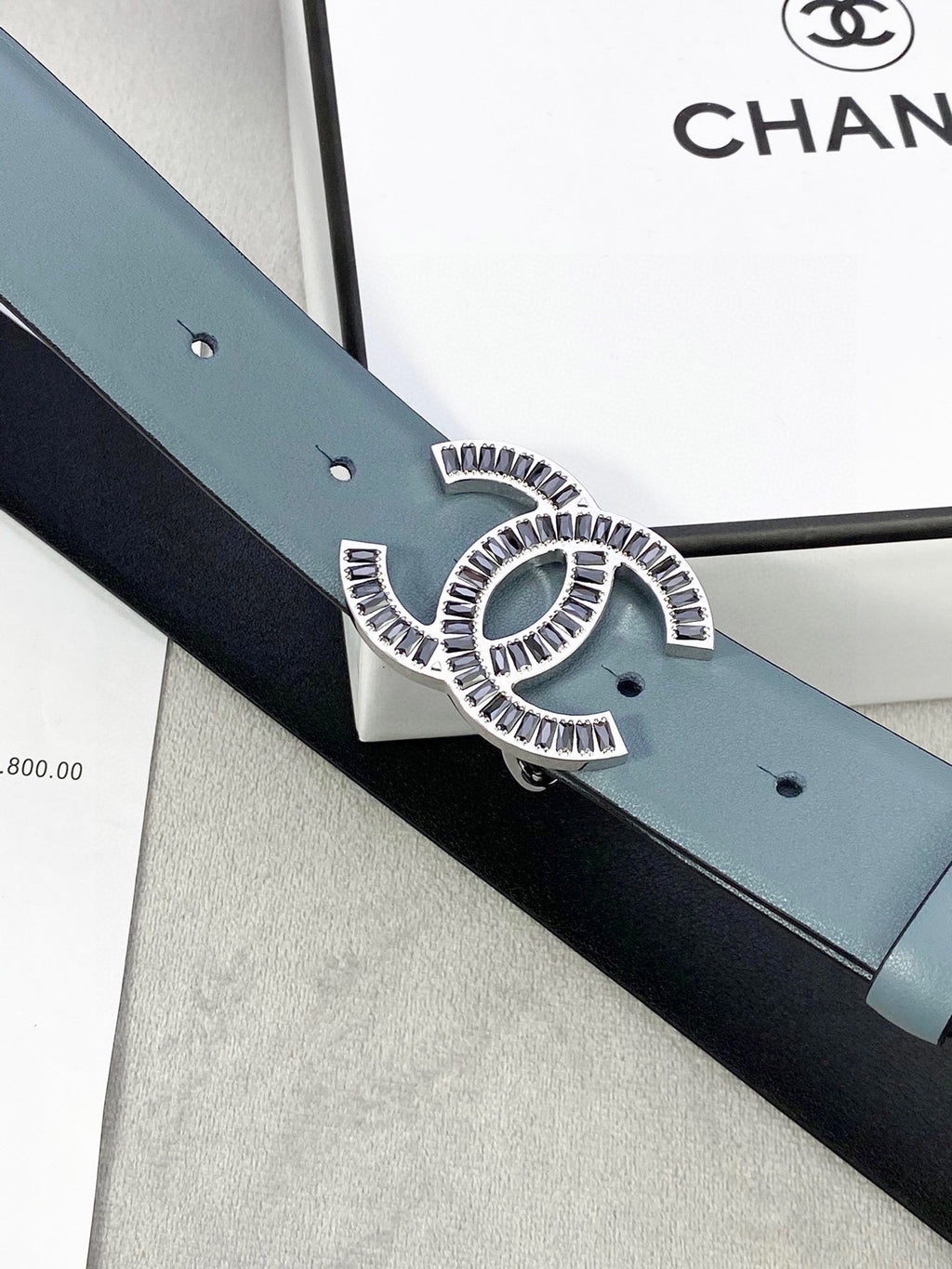 Chanel CC buckle on muted blue leather belt with adjustable holes