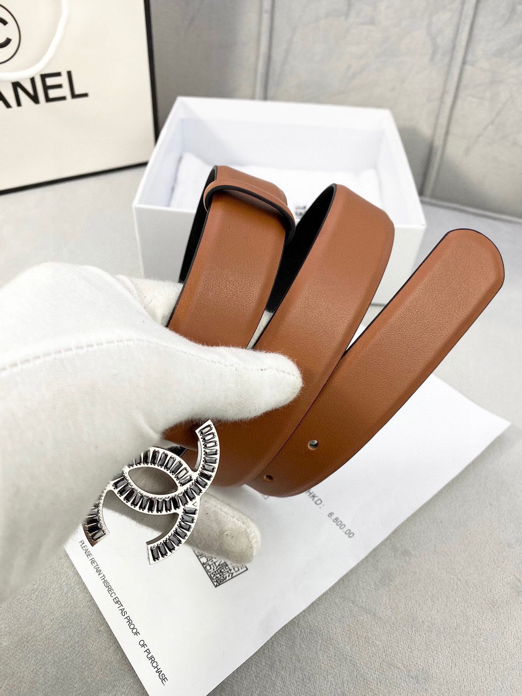 Chanel reversible leather belt with tan and black sides, gold-tone CC buckle