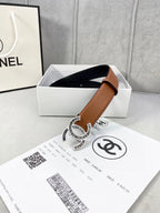 Chanel leather belt in tan with gold-tone interlocking CC buckle, shown in gift box