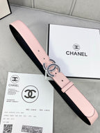 Chanel belt with pale pink leather strap and gold logo buckle over black lining