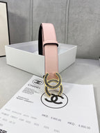Chanel belt with pale pink leather strap and gold logo buckle, side view