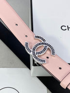 Chanel belt detail: pale pink leather strap with gold logo buckle and signature cutout design