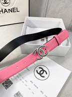Chanel belt on box: pink strap with silver CC buckle featuring red center, black underside.