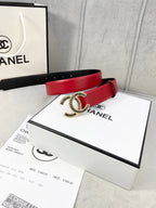 Chanel belt with red leather strap and CC logo buckle on display packaging