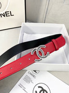 Chanel belt featuring red leather strap with CC logo buckle and punched adjustment holes