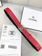 Chanel belt showing red leather front and black underside with CC logo buckle