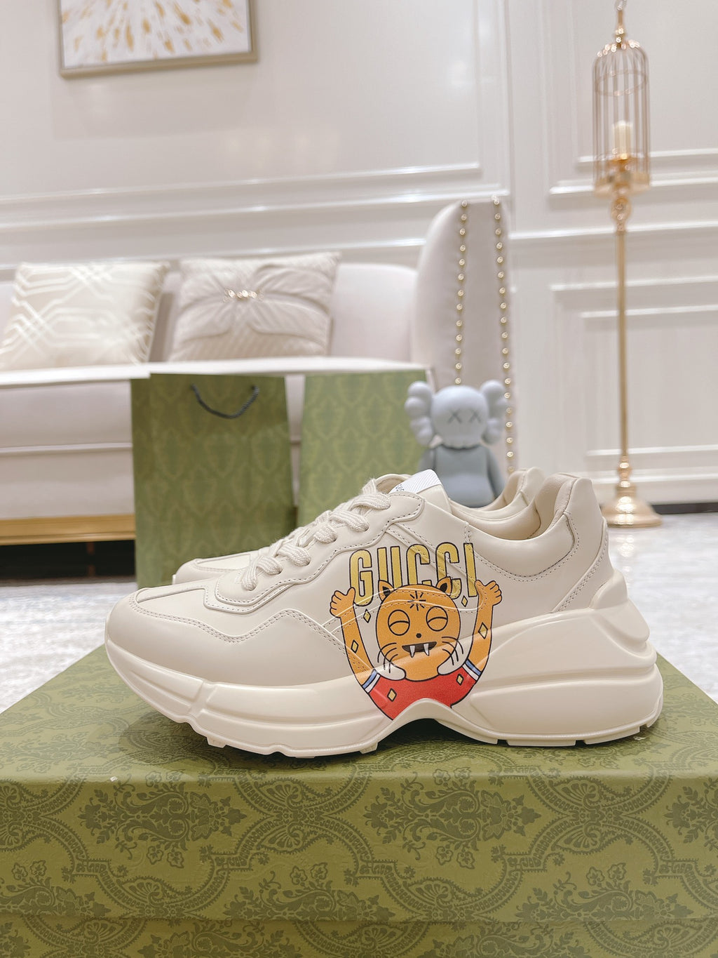 White Gucci sneakers with cartoon front graphic and low-profile sole