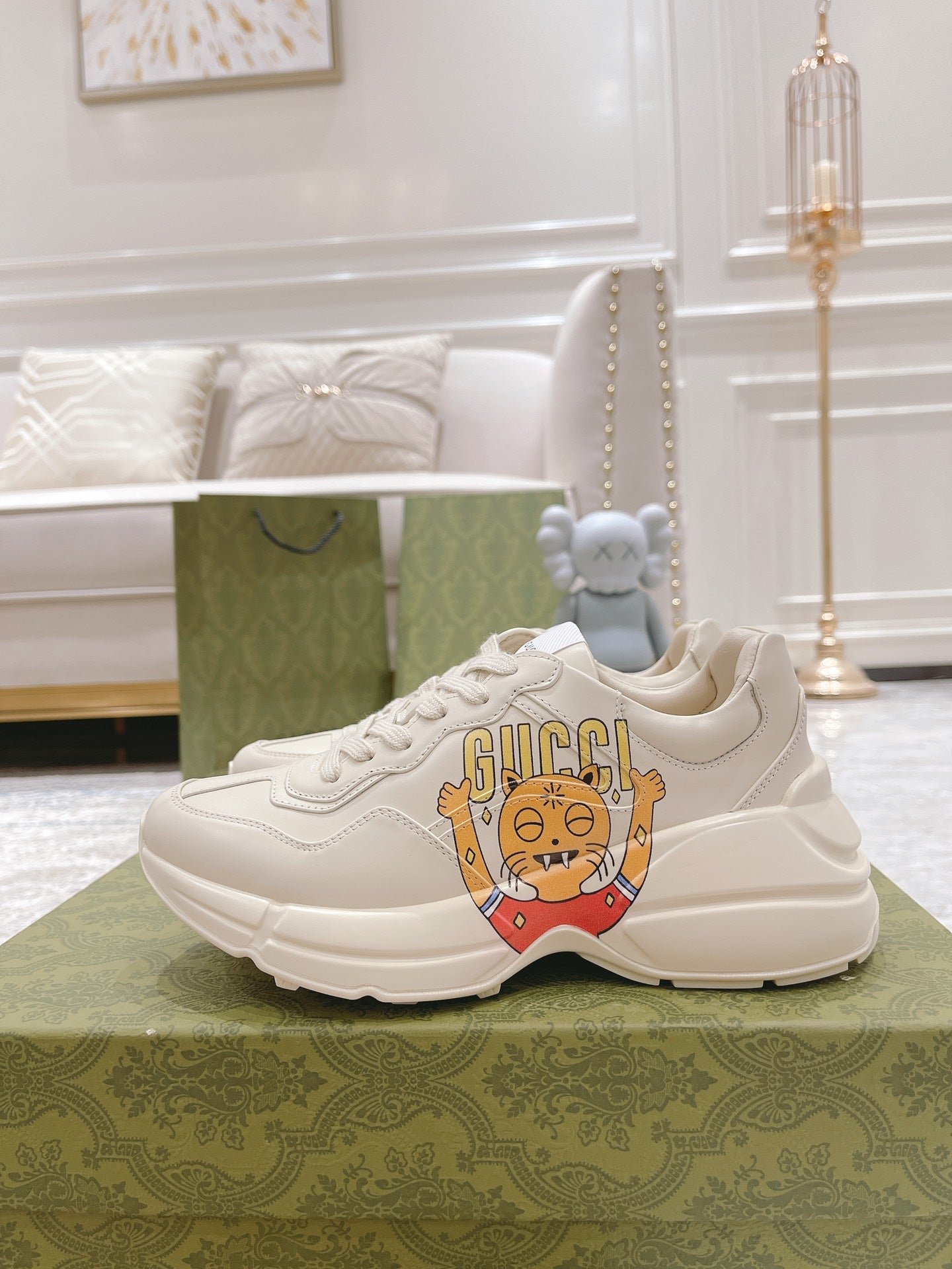 White Gucci sneakers with cartoon front graphic and low-profile sole