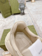 White Gucci sneaker interior with cushioned collar and fabric lining