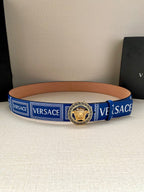 Versace belt with blue webbing and gold-tone round medallion buckle on tan leather edge