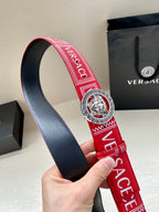 Versace belt showing red strap lining with navy underside and lion buckle