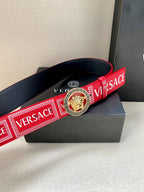 Versace belt with red logo strap, navy edges, and circular lion buckle