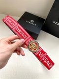 Versace belt with red patterned strap and circular gold lion buckle