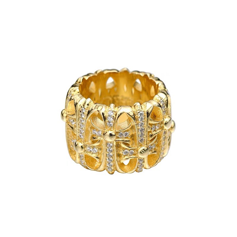 Gold-tone crystal-studded chrome ring with patterned band and raised center stones