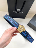 Designer belt with blue geometric pattern and gold lion-head buckle