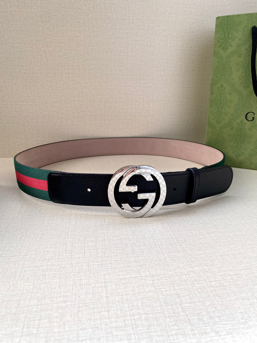 Gucci belt with navy leather strap and silver-toned GG buckle, green-red web stripe detail