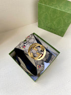 Gucci belt in navy GG monogram with Mickey print; gold-tone interlocking buckle