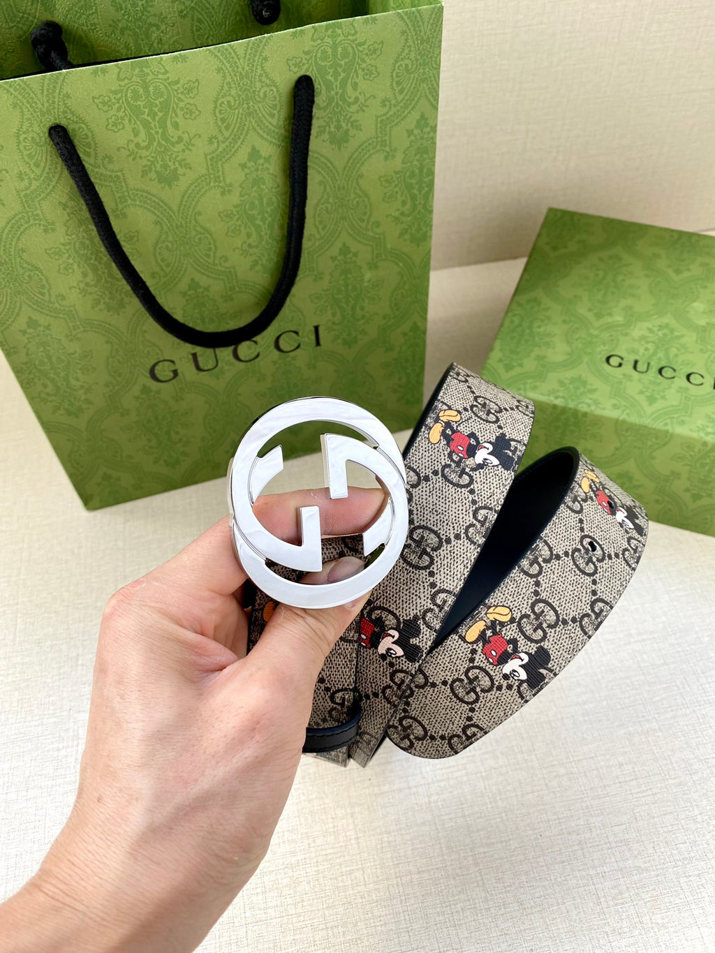 Gucci belt with GG monogram Mickey print and navy leather; silver interlocking buckle