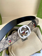 Gucci belt with navy GG monogram and Mickey print strap; silver interlocking G buckle